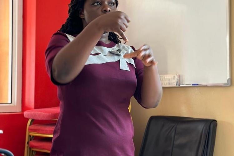 A young woman making her presentation in Sign Language